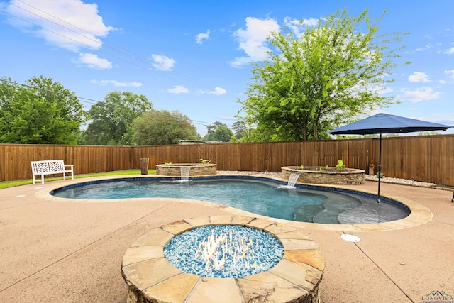 view of swimming pool featuring a fenced backyard, a fenced in pool, and a patio area