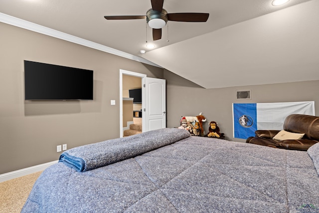 carpeted bedroom featuring ceiling fan, visible vents, baseboards, ornamental molding, and lofted ceiling