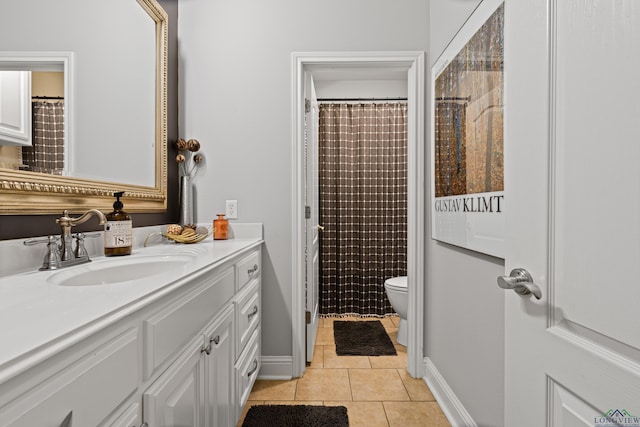 bathroom with tile patterned floors, toilet, curtained shower, and vanity