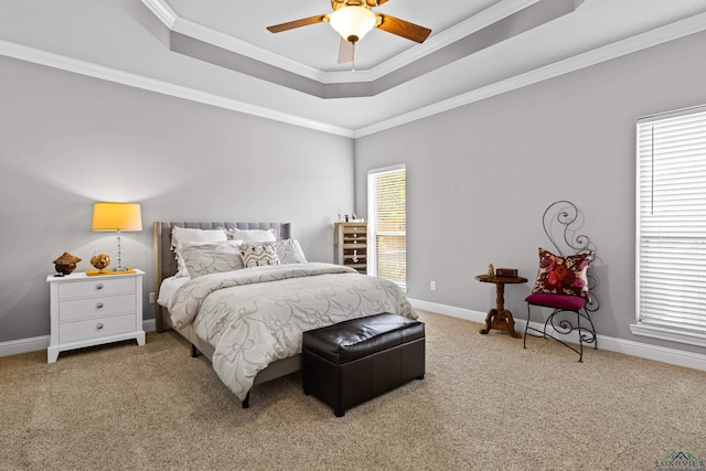bedroom featuring ornamental molding, carpet, a raised ceiling, and baseboards
