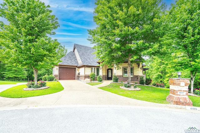 view of front facade with a front lawn and a garage