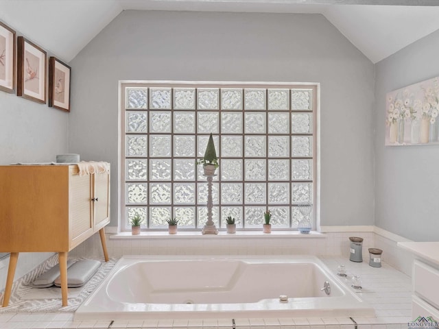 591 N Live Oak Rd, Gilmer, TX 75644 - full bathroom featuring lofted ceiling and a garden tub