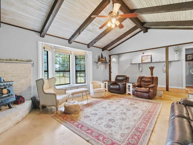 591 N Live Oak Rd, Gilmer, TX 75644 - living area featuring a wood stove, ceiling fan, and wood ceiling