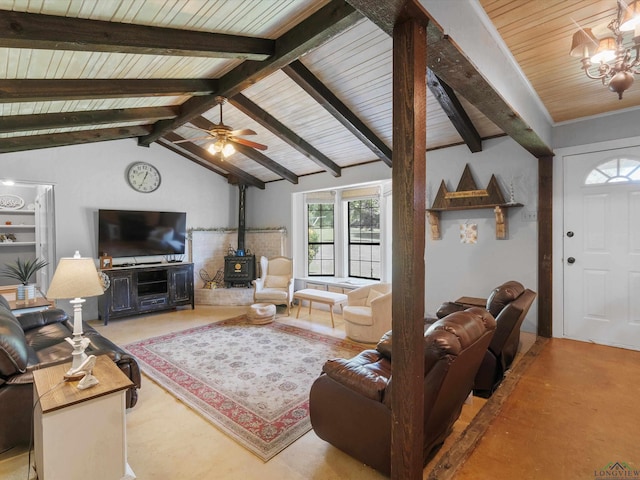 591 N Live Oak Rd, Gilmer, TX 75644 - living area with a wood stove, wood ceiling, ceiling fan, and a chandelier