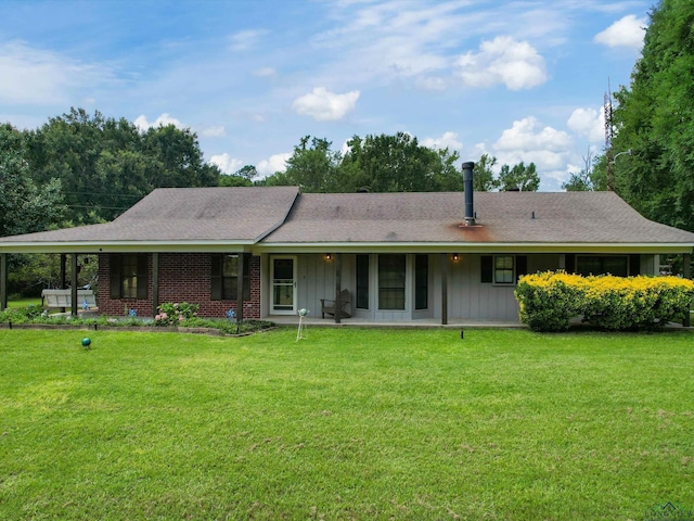 591 N Live Oak Rd, Gilmer, TX 75644 - rear view of house featuring a lawn