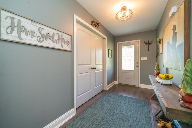 doorway with dark wood-type flooring