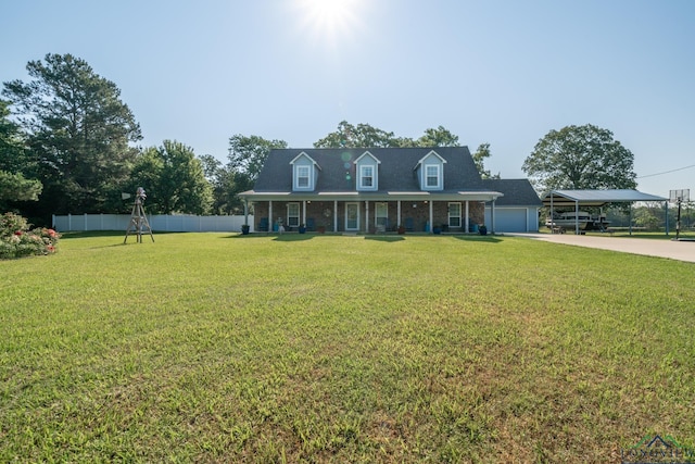 view of front of house with covered porch, a garage, and a front lawn