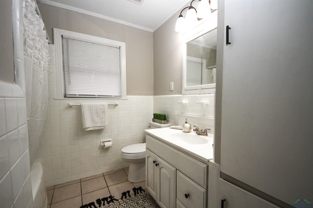 full bathroom featuring a shower with shower curtain, vanity, tile patterned flooring, toilet, and tile walls