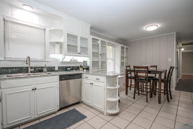 kitchen featuring a peninsula, white cabinetry, open shelves, dishwasher, and a sink
