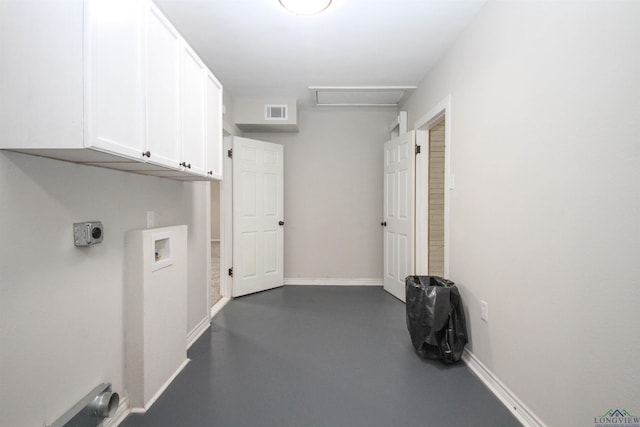 washroom with visible vents, baseboards, washer hookup, cabinet space, and electric dryer hookup