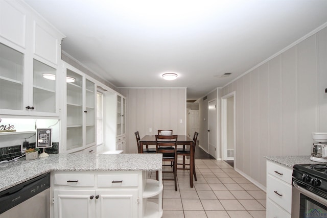 kitchen featuring crown molding, light tile patterned floors, open shelves, white cabinets, and appliances with stainless steel finishes