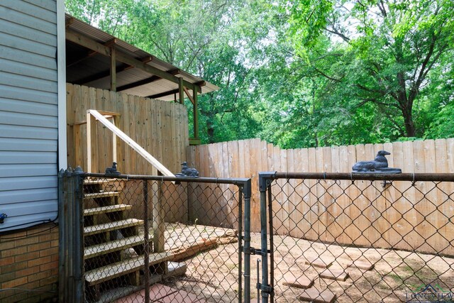 view of yard with a gate and fence