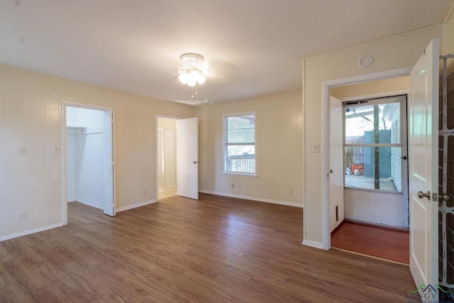 1321 Lake Dr, Longview, TX 75601 - spare room featuring wood finished floors, baseboards, a ceiling fan, and a smoke detector