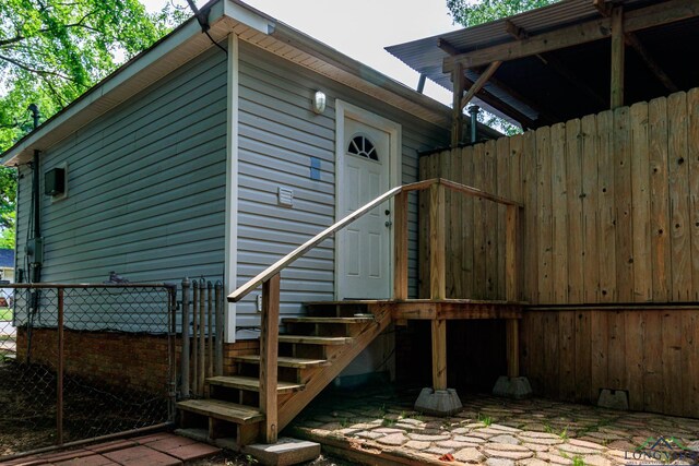 view of side of home with fence
