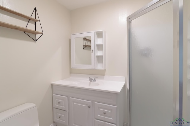 1321 Lake Dr, Longview, TX 75601 - bathroom with vanity, toilet, and a stall shower