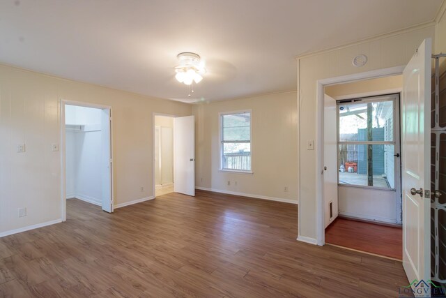 1321 Lake Dr, Longview, TX 75601 - unfurnished room with wood finished floors, baseboards, a ceiling fan, and a smoke detector