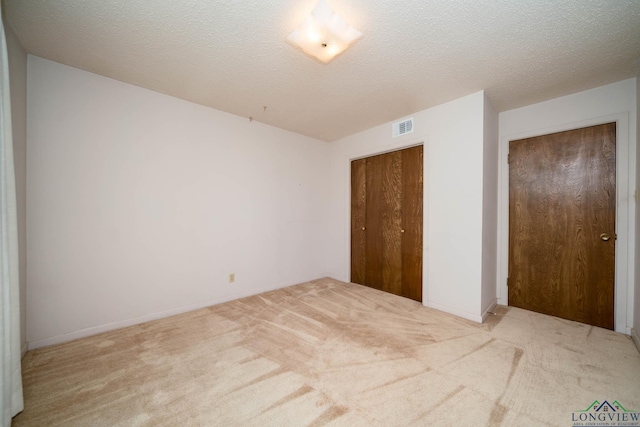 107 Tulip St, White Oak, TX 75693 - unfurnished bedroom with visible vents, baseboards, carpet flooring, and a closet