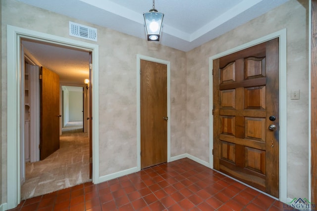 107 Tulip St, White Oak, TX 75693 - entryway with baseboards, dark tile patterned floors, and visible vents