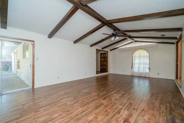 107 Tulip St, White Oak, TX 75693 - unfurnished living room featuring vaulted ceiling with beams, a ceiling fan, and wood finished floors