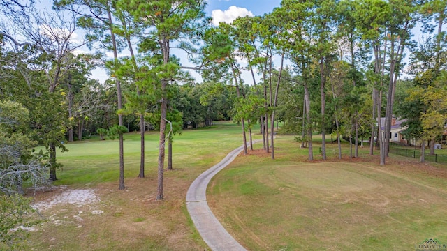 view of property's community featuring a lawn