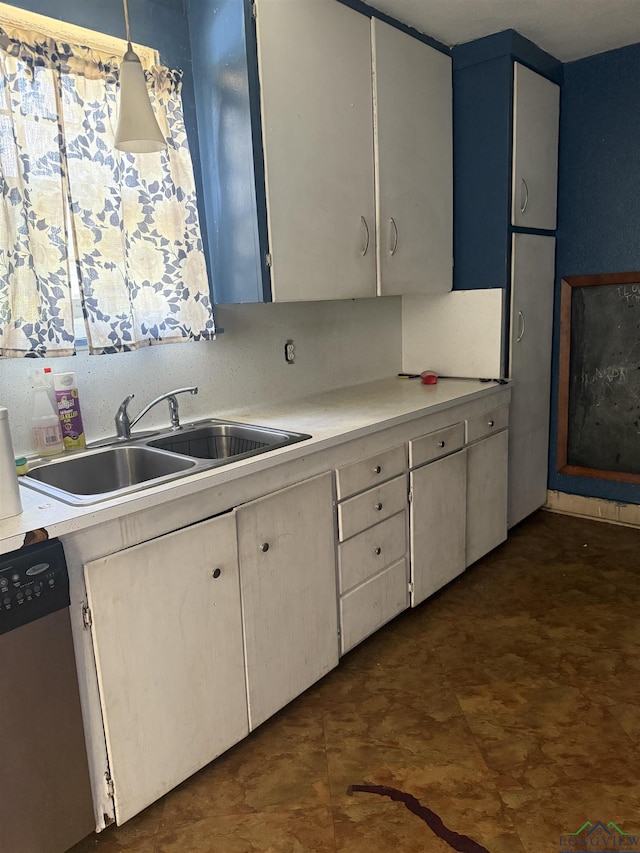 1701S Washington St, Marshall, TX 75670 - kitchen featuring stainless steel dishwasher and light countertops