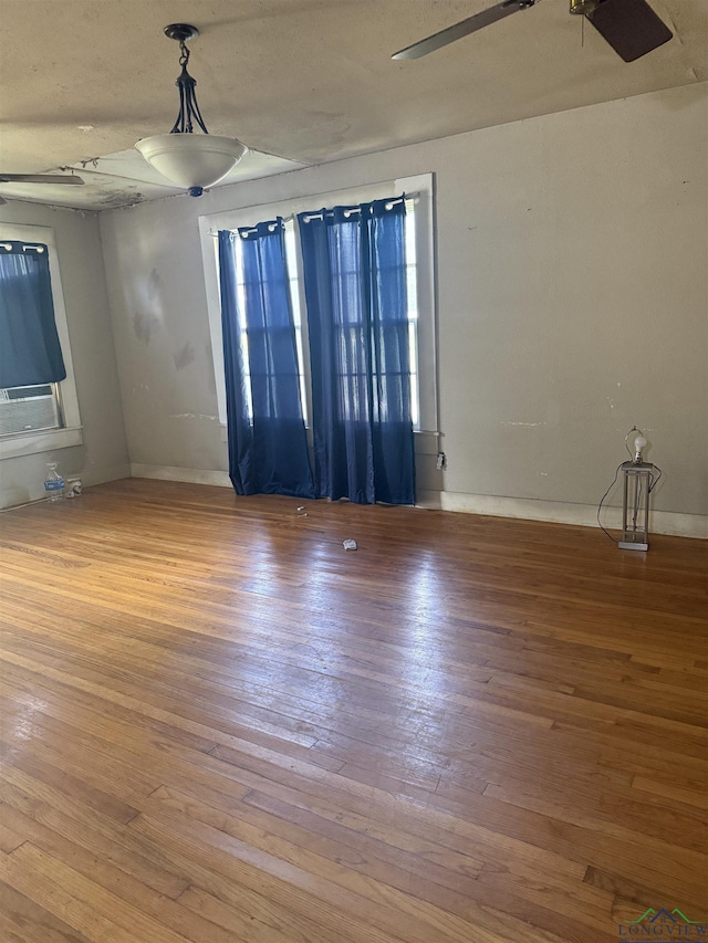 1701S Washington St, Marshall, TX 75670 - unfurnished room featuring a ceiling fan and wood-type flooring