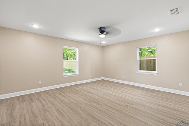 spare room featuring ceiling fan, recessed lighting, visible vents, baseboards, and light wood finished floors