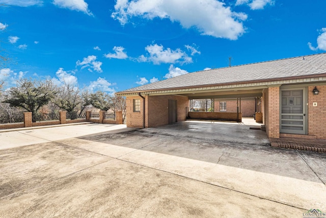 view of side of property featuring a carport