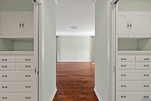 hall with dark wood-type flooring