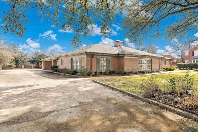 single story home with a garage and a front yard