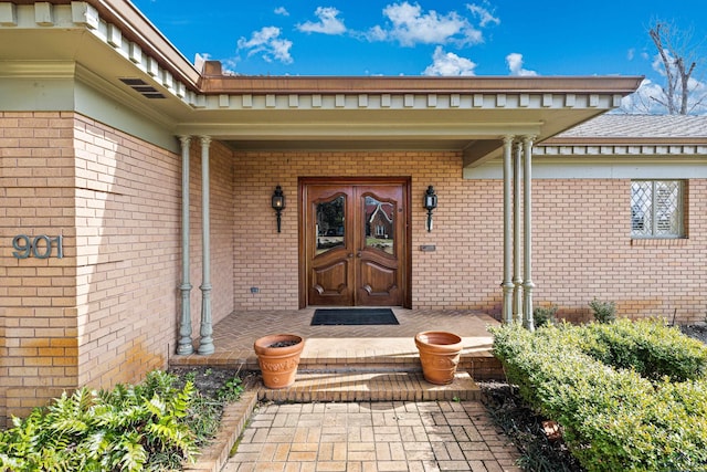 doorway to property featuring covered porch