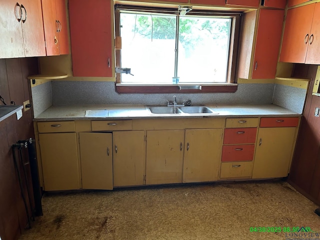 kitchen with a sink and light countertops