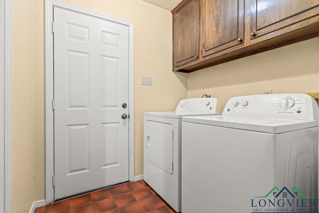 laundry room with cabinets and washing machine and dryer