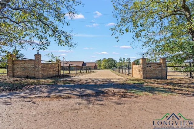 view of gate featuring a rural view