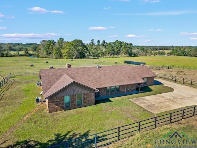 birds eye view of property with a rural view