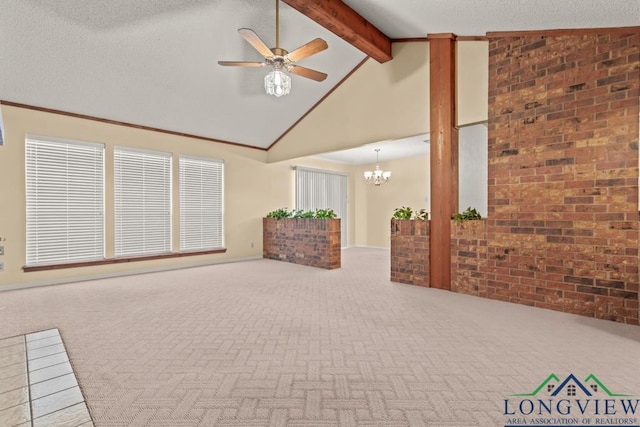 unfurnished living room with beam ceiling, carpet flooring, high vaulted ceiling, brick wall, and ceiling fan with notable chandelier