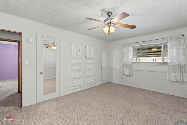 1320 Pinehill Dr, Jefferson, TX 75657 - unfurnished bedroom with carpet floors, ornamental molding, a textured ceiling, and ceiling fan