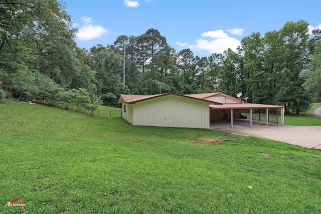 1320 Pinehill Dr, Jefferson, TX 75657 - view of outbuilding featuring an attached carport and driveway