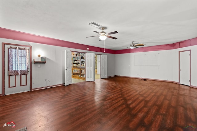 1320 Pinehill Dr, Jefferson, TX 75657 - unfurnished living room with wood finished floors, ceiling fan, and baseboards