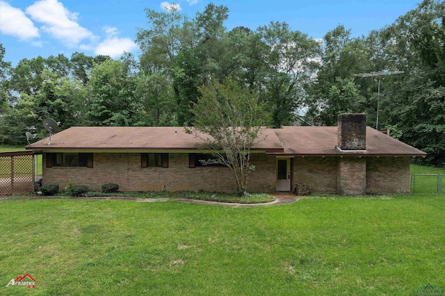 1320 Pinehill Dr, Jefferson, TX 75657 - rear view of property with brick siding and a chimney