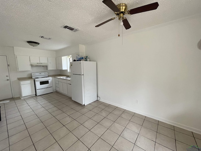 kitchen featuring white appliances, ceiling fan, light tile patterned floors, a textured ceiling, and white cabinetry