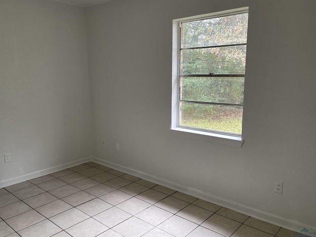 view of tiled spare room