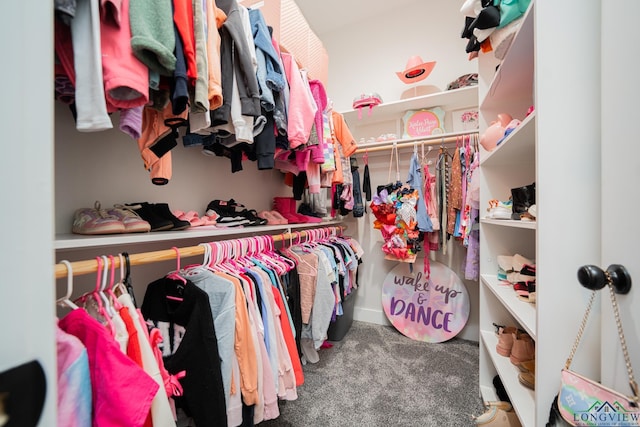 walk in closet featuring carpet