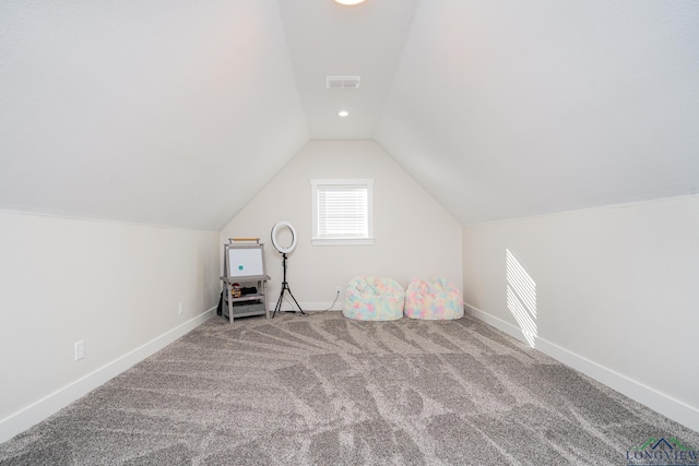 bonus room featuring carpet floors and lofted ceiling