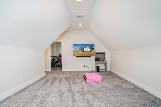 bonus room with carpet flooring and lofted ceiling