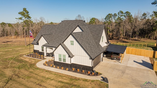 view of front of house featuring a front lawn and a carport