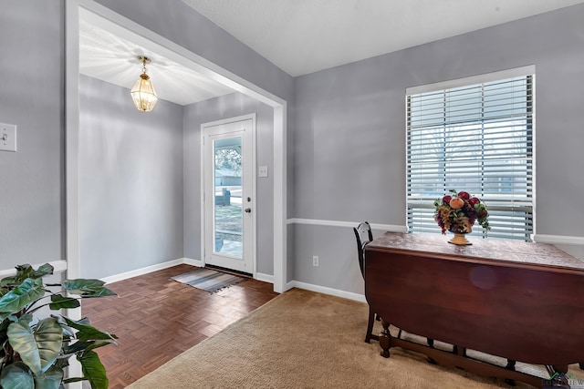 interior space featuring baseboards