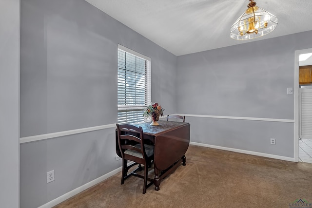 office space with a notable chandelier, carpet floors, and baseboards