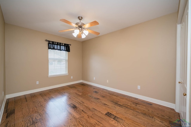 empty room featuring ceiling fan and hardwood / wood-style flooring