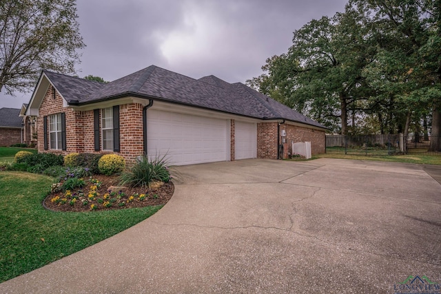 view of home's exterior with a yard and a garage